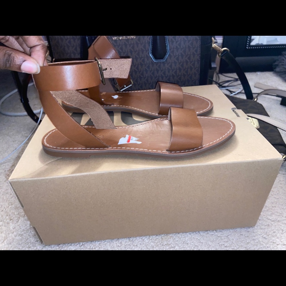 A brown pair of sandals
